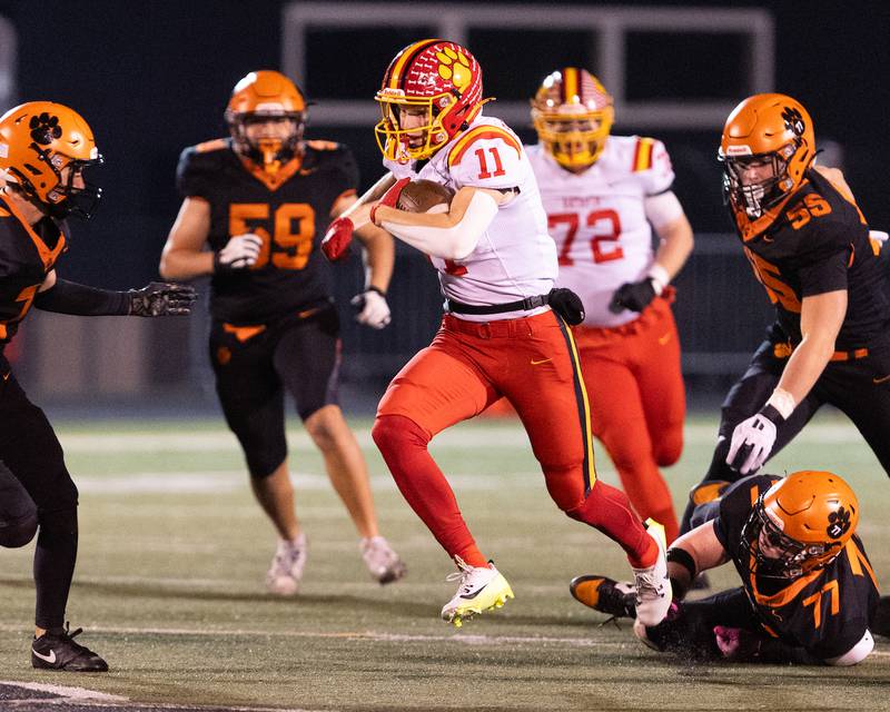 Batavia's Brett Berggren makes a run for a gain against Wheaton Warrenville South on Friday, Oct. 24,2025 in Wheaton.
