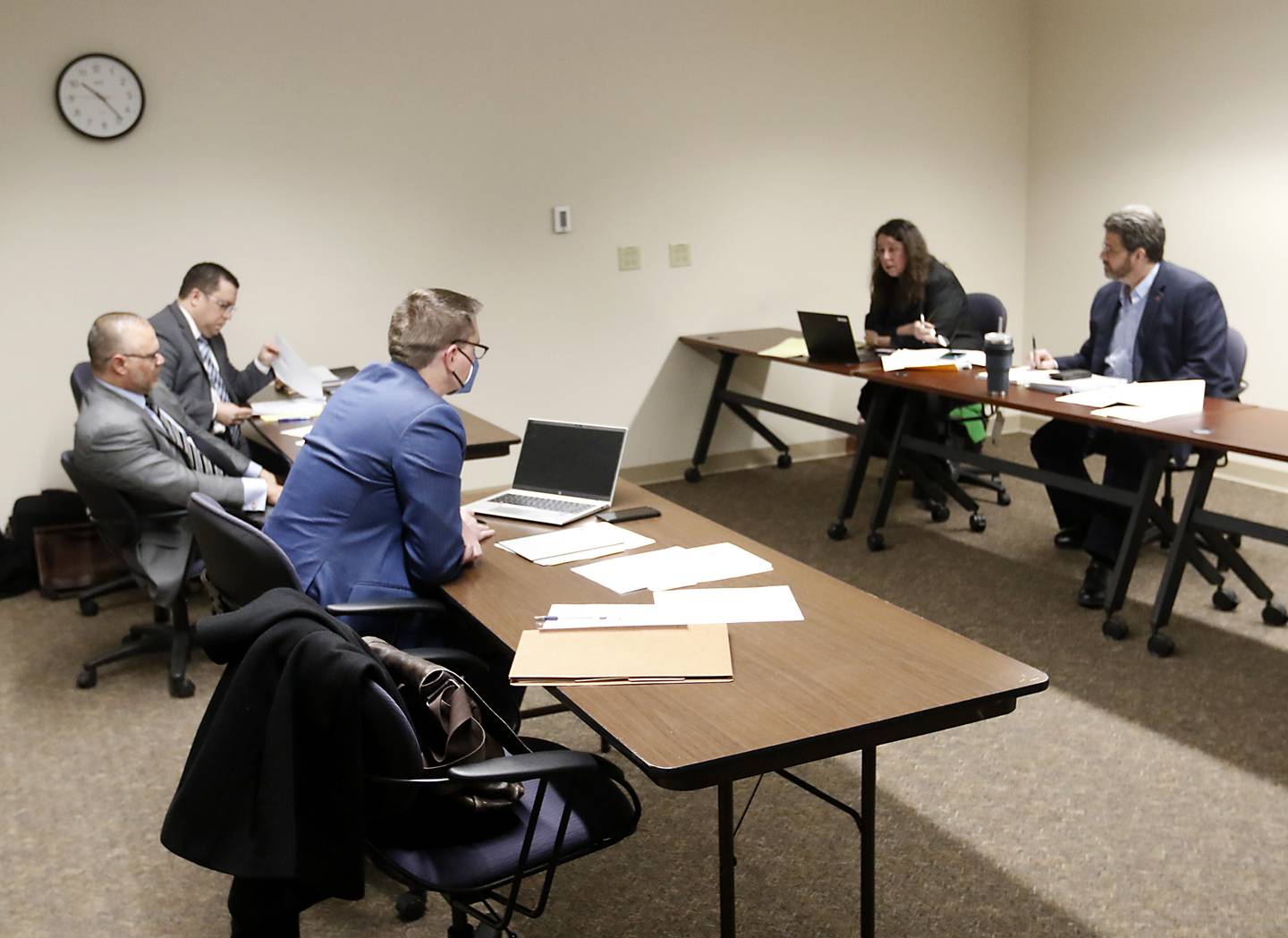 Attorneys Troy Owens, from left to right, Kevin Chrzanowski, and Daniel Bolin file a motion Monday, March 28, 2022, for Lake County Assistant State's Attorney Lisle A. Stalter, McHenry County Clerk Joe Tirio and McHenry County Circuit Clerk Manager Debra Schmitt (not pictured) be removed from the McHenry County Electoral Board for the objection hearing of sheriff candidate Tony Colatorti. The hearing, held at the McHenry County Administration Building in Woodstock, is the result of an objection filed the week prior by William Brogan and Joel Brumlik disputing Colatorti's qualifications to run for the position of McHenry County sheriff.