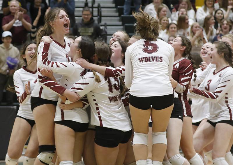 Prairie Ridge celebrates their win over Crystal Lake Central in a IHSA Class 3A regional final volleyball match Thursday, Oct. 27, 2022, at Crystal Lake South High School.