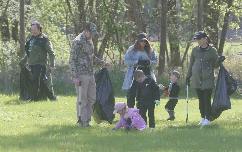 Volunteers collect trash during the Perfectly Flawed Foundation cleanup on Saturday, April 26, 2025 near the Lock 14 shelter on the Illinois & Michigan Canal in La Salle.