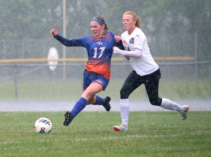 Genoa-Kingston's Nora Foss kicks the ball away from Rockford Christian's Keylee Cortese Tuesday, May 20, 2025, during their Class 2A regional final game at Rockford Christian High School.