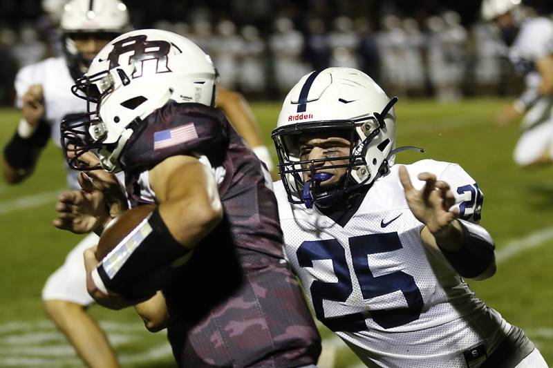 Cary-Grove's Colin Desmet, left, tackles Prairie Ridge's Tyler Vasey during a Fox Valley Conference football game between Prairie Ridge  and Cary-Grove Friday, Sept. 23, 2022, at Prairie Ridge High School in Crystal Lake.