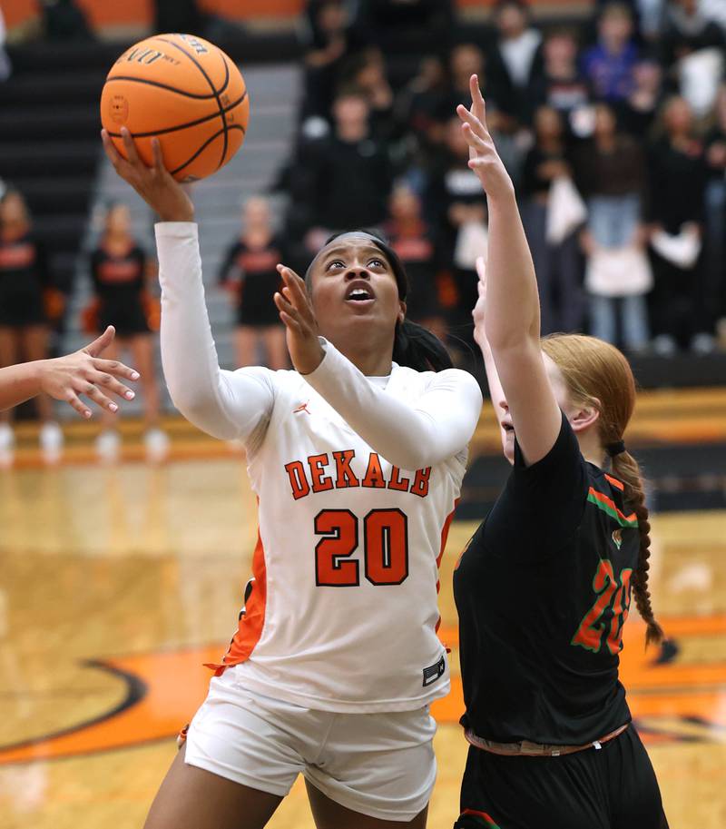 DeKalb's Zora Watts shoots over Plainfield East's Heather Bunker Thursday, Feb. 12, 2026, during their game at DeKalb High School.