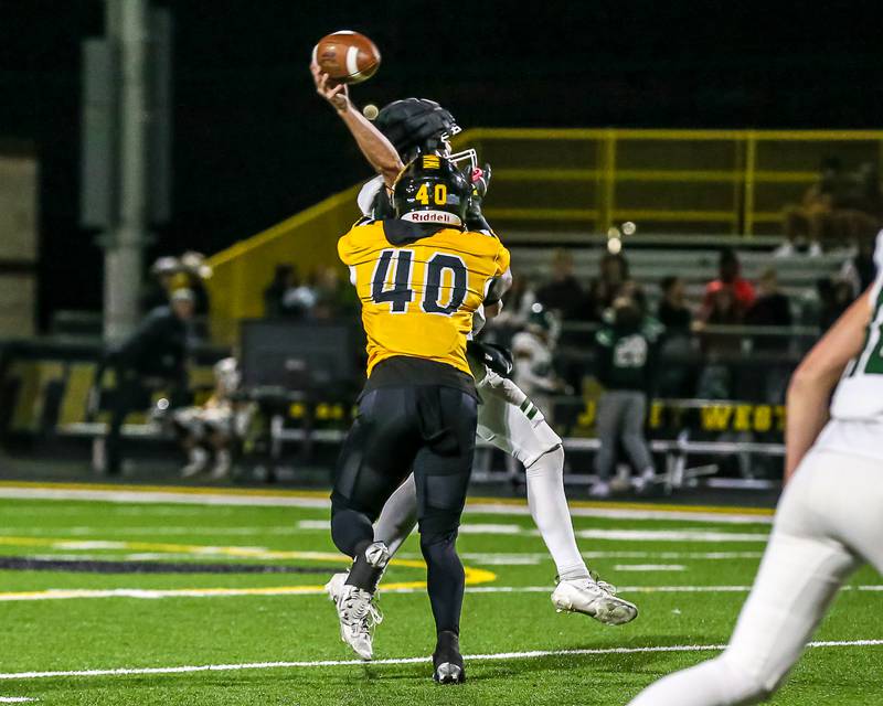 Joliet West's Mohamed Kosh (40) puts a hit on Plainfield Plainfield Central's  Tommy Morrisette (1) during a football game between Plainfield Central at Joliet West on Friday, Oct 25th, 2024  in Joliet.