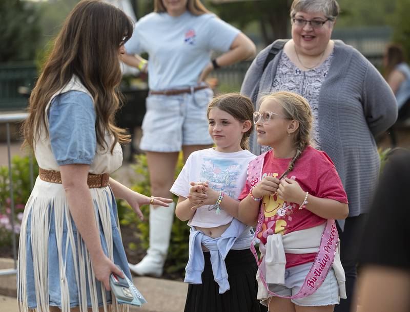 Country musician Delaney Ann speaks to young fans Maggie Shaddick (left), 7, and Braelynn Helfrich, 8, after her set Saturday, May 31, 2025, at the River Country Summer Kickoff 2025 in Dixon.