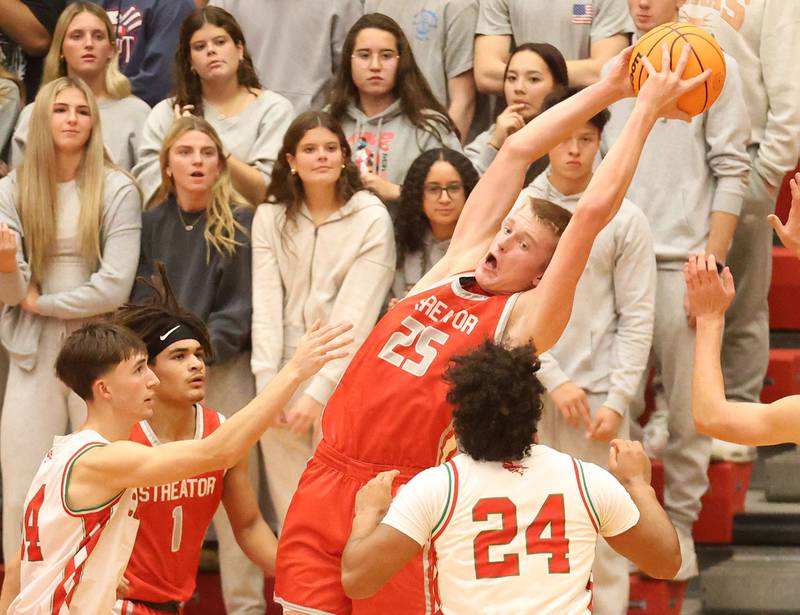 Streator's Joseph Hoekstra leaps in the air to grab a rebound during the Dean Riley Shootin' The Rock Thanksgiving Tournament on Monday Nov. 24, 2025 in Kingman Gymnasium at Ottawa High School.