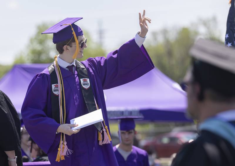 Aidan Brown sends love to the crowd Sunday, May 24, 2026, after receiving his diploma from Dixon High School.