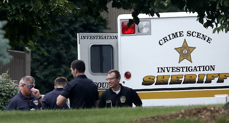Officers from the McHenry County Sheriff and other departments investigate a domestic incident in which four people were killed on Wednesday Aug. 9, 2023, in the 5800 block of Wild Plum Road in unincorporated Crystal Lake. Police said they were family members.