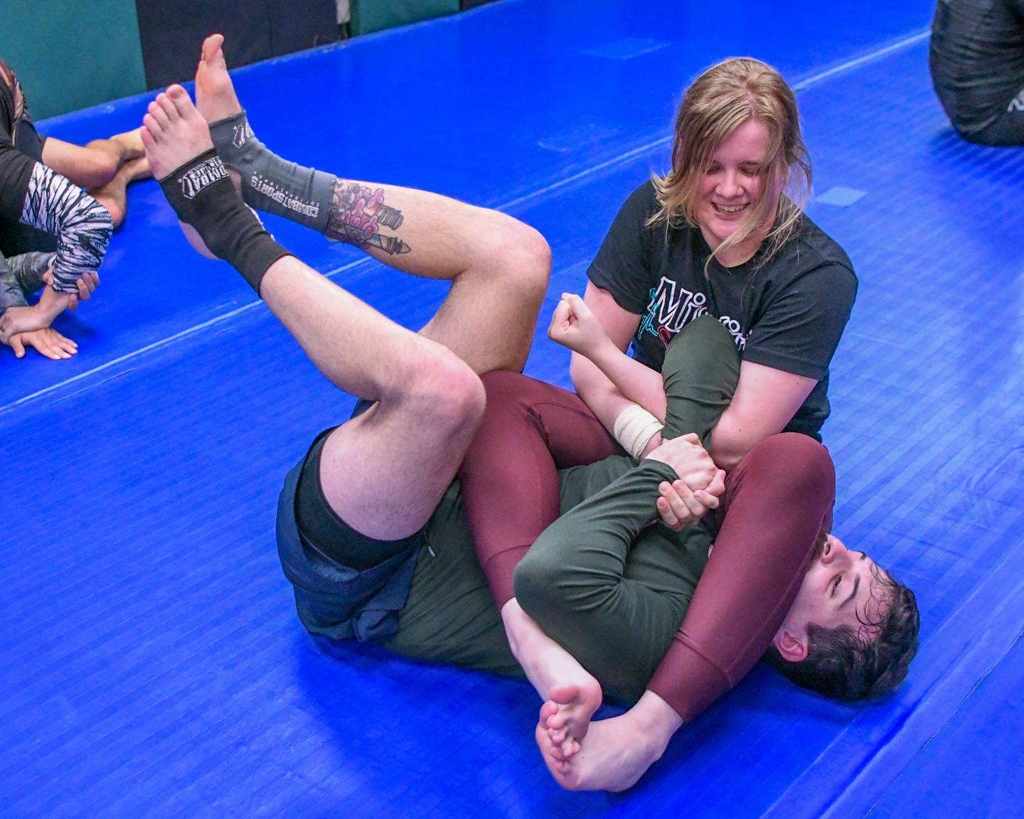 Sky Hone of Elburn, rear, works on a move she learned in class with classmate Dane Gonzalez of St. Charles on Wednesday March 3, 2024, at the Ju jitsu company named The Misfits.