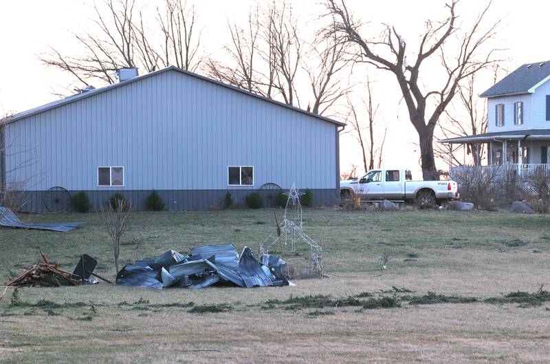 Debris sits in the front yard of a property along East Sandwich Road in Hinckley Wednesday, Feb. 28, 2024, after a tornado hit the area Tuesday night.