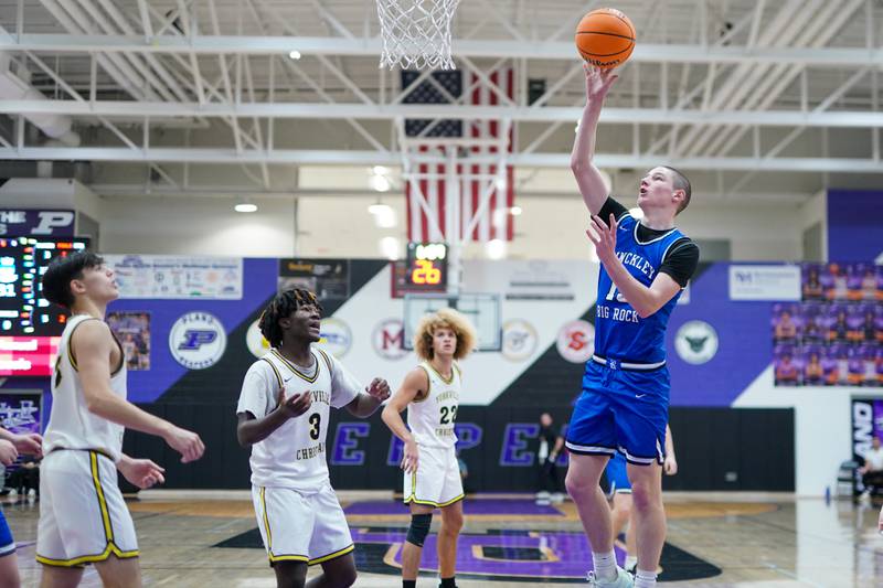 Hinckley-Big Rock's Jacob Orin (13) shoots the ball in the post against Yorkville Christian's Jayden Riley (3) during a basketball game in the opening round of the 61st annual Plano Christmas Classic at Plano High School on Monday, December 23, 2024.