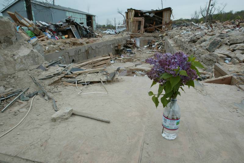 Flowers are placed near the enterance to the Milestone Tap that was leveled by the tornado on April 20, 2004 downtown Utica.