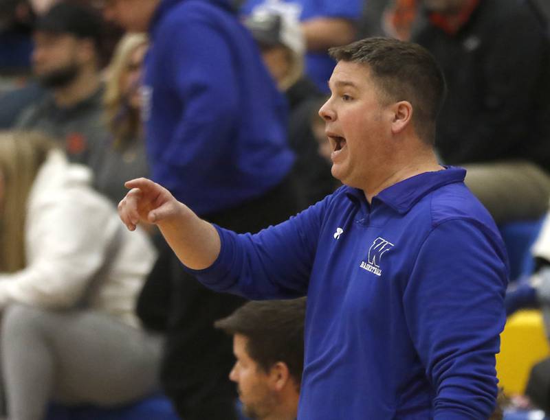 Woodstock coach Ryan Starnes communicates with his players during a Kishwaukee River Conference boys basketball game against Johnsburg Tuesday, Jan. 31, 2023, at Johnsburg High School.