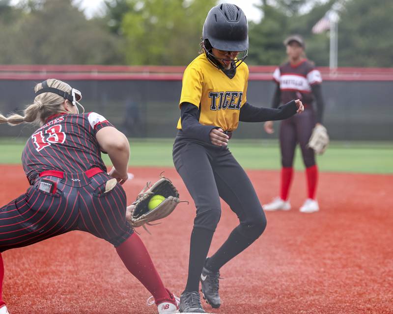 Joliet West's London Clemons (3) gets back to first during a pickoff attempt during softball game between Joliet West at Yorkville on Wednesday, April 30, 2025 in Yorkville.