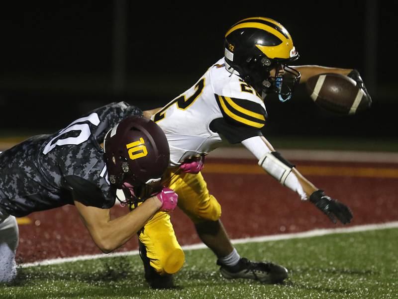 Richmond-Burton's Max Loveall tackles Harvard's Christian Mercado during a Kishwaukee River Conference football game on Thursday, Oct.12, 2023, at Richmond-Burton High School.