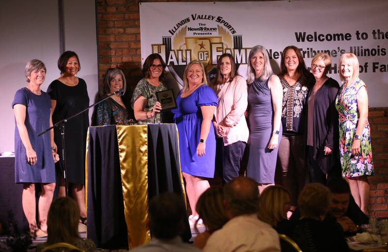 Members of the 1990 Princeton High School volleyball team pose for a photo during the Shaw Media Illinois Valley Sports Hall of Fame on Thursday, June 8, 2023 at the Auditorium Ballroom in La Salle. The team won the Class A State title under legendary coach Rita Placek.
