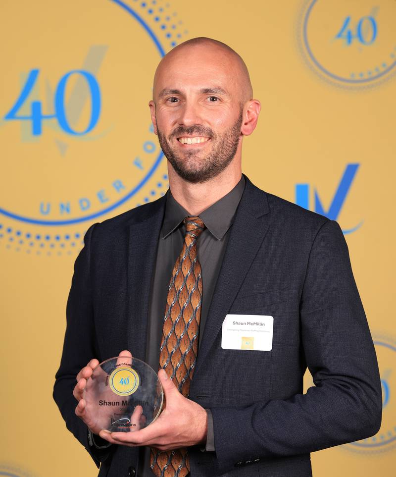 Shaun McMillin poses with his 40 Under Forty award during the Illinois Valley Chamber of Commerce Champions of Change Awards Night on Thursday, April 10, 2025 at the Westclox Event Center in Peru.