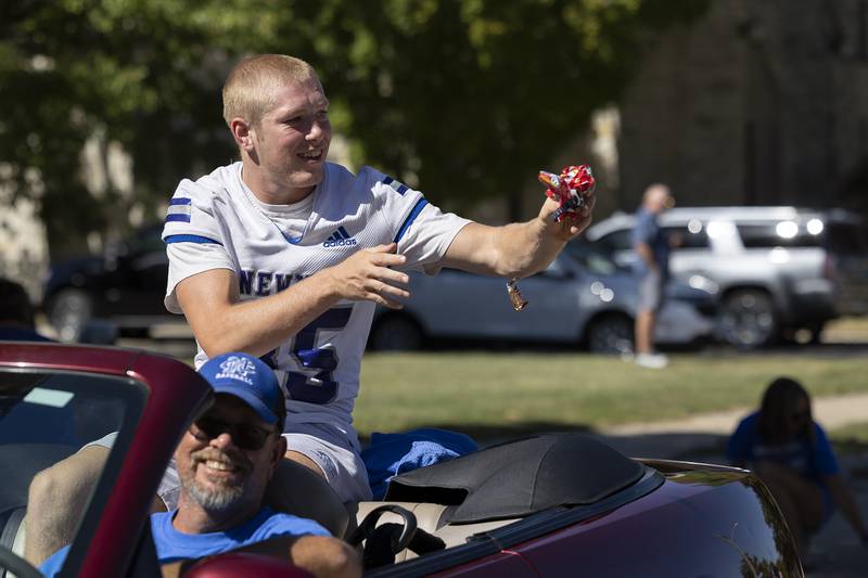 Daniel Kelly, tosses out treats Friday, Sept. 20, 2024, during Newman High School’s homecoming parade.
