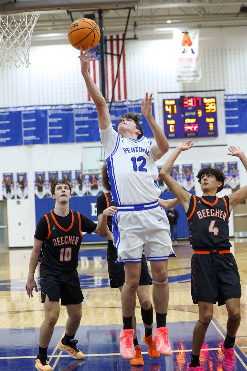 Peotone's Tyler Walker tosses in a layup during the Blue Devils' 64-52 victory over Beecher on Wednesday, Jan. 28, 2026.