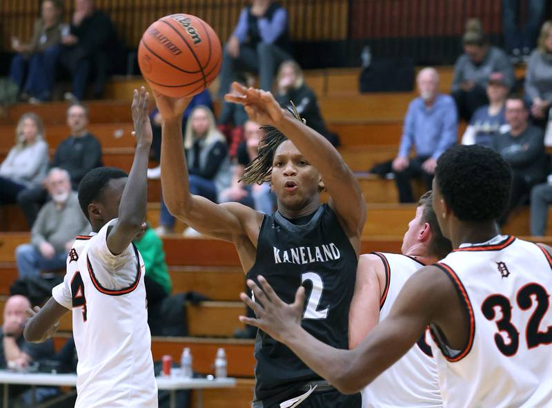 Kaneland's Isaiah Gipson passes the ball away from three DeKalb players during their game Monday, Feb. 12, 2024, at Huntley Middle School in DeKalb.