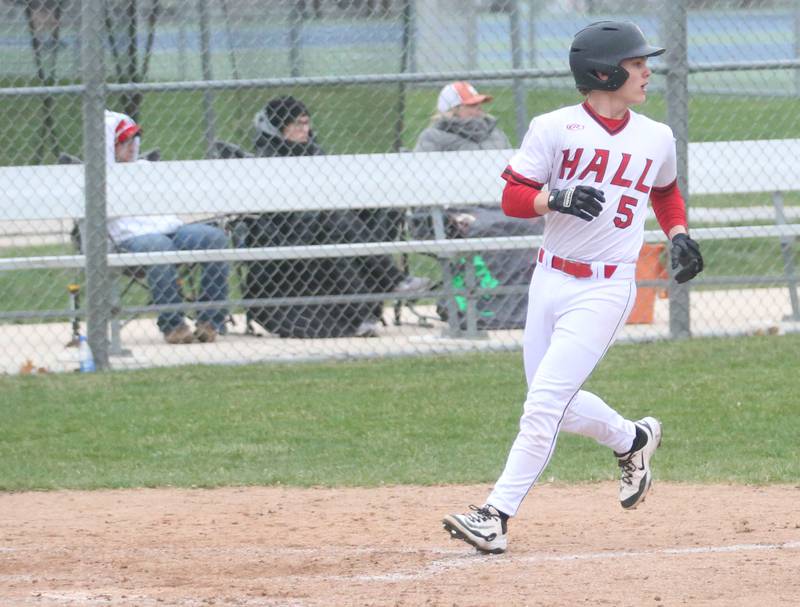 Hall's Greyson Bickett scores a run against Ottawa on Tuesday, April 1, 2025 at Ottawa High School.