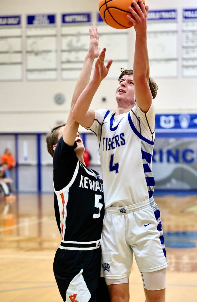 Princeton's Julian Mucha shoots over Kewanee's Griff HicksTuesday night at Prouty Gym. The Boilermakers won 75-60.