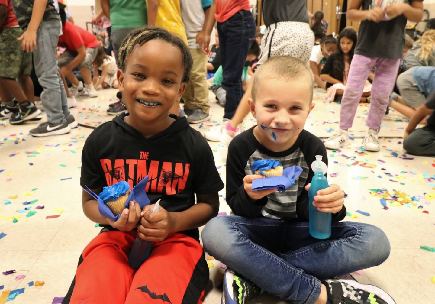 Eisenhower Academy was named a 2022 National Blue Ribbon School on Friday, Sept. 16, 2022. Students and staff celebrated their achievements that same day with music, blue cupcakes, blue juice and confetti. Pictured are, from left, Eisenhower students Jayce Samuel and Cole Rogers.