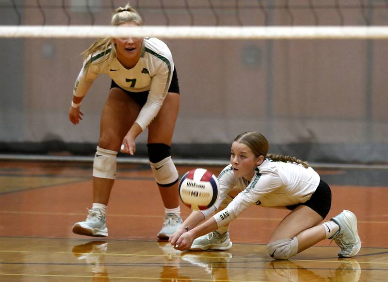 Crystal Lake South's Layla Addison (right) digs the ball in front of her teammate, Laken Lepage, during the IHSA Class 3A Crystal Lake Central Regional volleyball final on Oct. 31, 2024, at Crystal Lake Central High School.