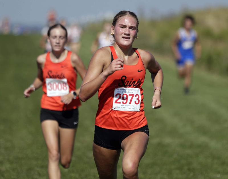 St. Charles East’s Marley Andelman and Brooklyn Walker at the Kane County cross country meet Saturday August 27, 2022 at Northwestern Medicine Field in Geneva.