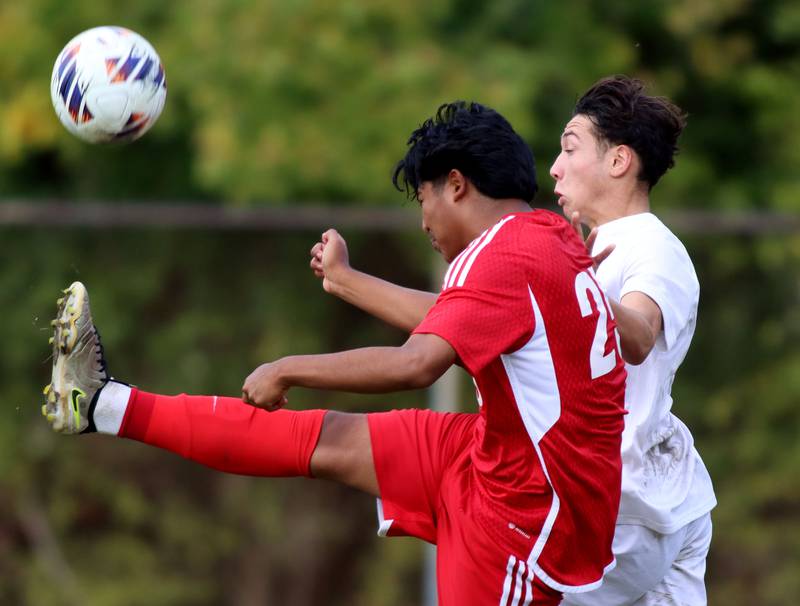 Dundee-Crown’s Cesar Sosa, front, battles St. Charles East’s Huxley Kapoor in IHSA Class 3A Regional Championship soccer at Dundee-Crown High School in Carpentersville on Saturday, October 25, 2025.