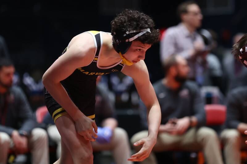 Harvard’s Marques Merida faces off against Unity’s Shane Ogden in the Class 1A 126 pound duel team 3rd place match at Grossinger Motor Arena in Bloomington. Saturday, Feb. 26, 2022, in Champaign.