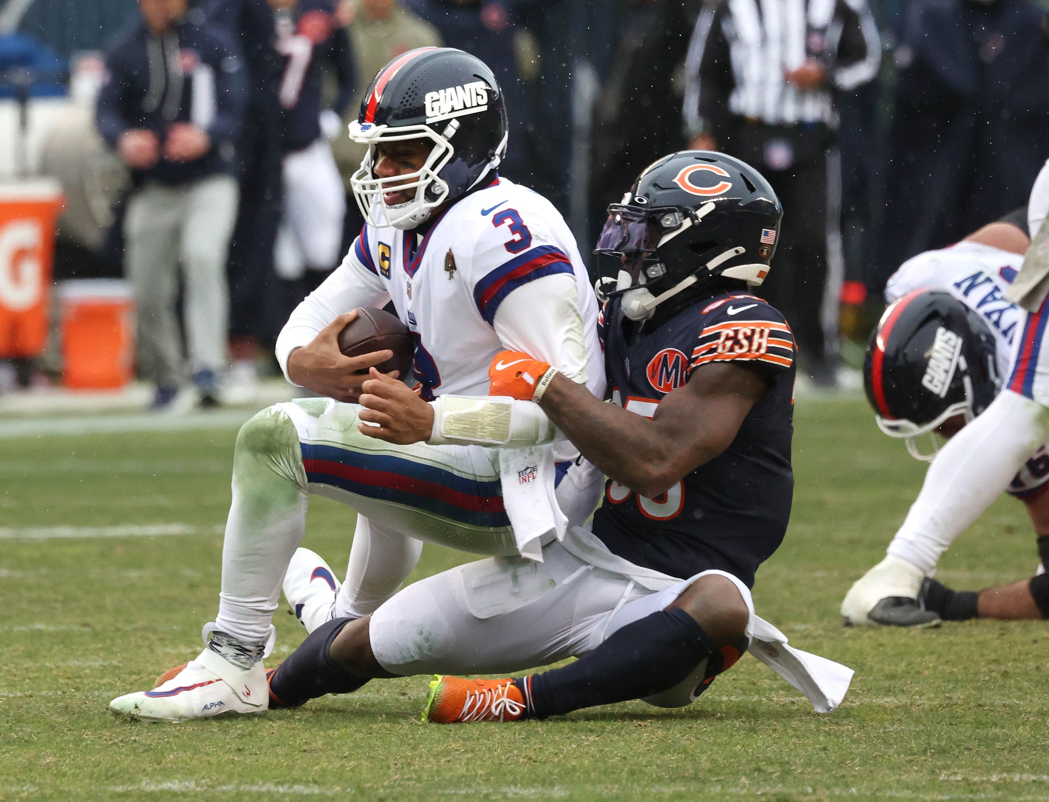 Chicago Bears safety C.J. Gardner-Johnson sacks New York Giants quarterback Russell Wilson for a sack Sunday, Nov. 9, 2025, during their game at Soldier Field in Chicago.