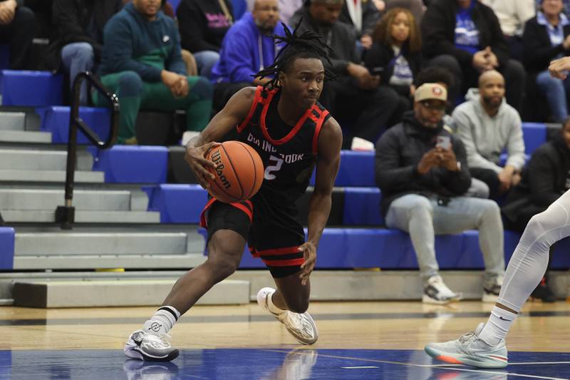 Bolingbrook’s DJ Strong looks to make a play against Lincoln-Way East on Tuesday, Dec.12th, 2023 in Frankfort.