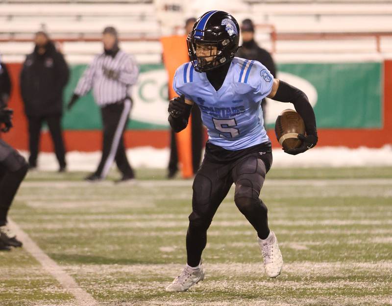 St. Francis's Zach Washington runs with the ball during the Class 5A State championship on Tuesday, Dec. 2, 2025 in Hancock Stadium at Illinois State University in Normal.