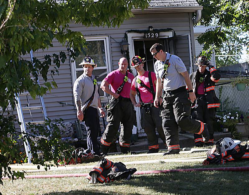 Ottawa, Naplate and Wallace firefighters work the scene of a house fire at 1529 Sycamore Street on Monday, Oct. 3, 2022 in Ottawa. The fire began shortly before 2p.m.