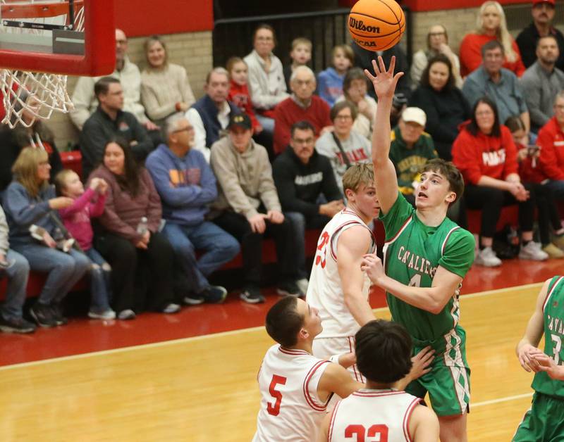 L-P's John Sowers lets go of a shot over Ottawa's Rory Moore on Friday, Feb. 6, 2026 in Kingman Gymnasium at Ottawa High School.
