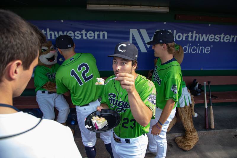 Koby Bishop (23) enjoys cake before a game against the Lake Country Dockhounds at Northwestern Medicine field on Tuesday, July 26, 2022