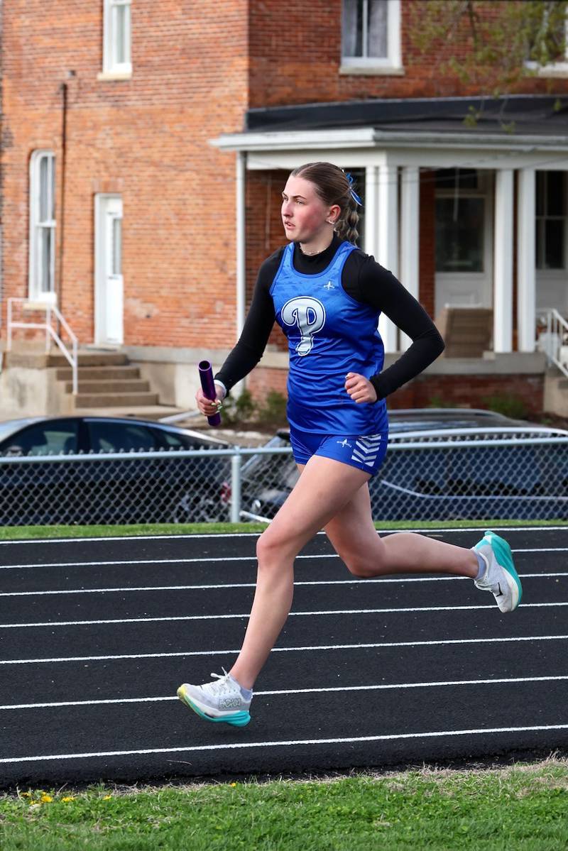 Princeton's Avery Waca runs a relay in Monday's Ferris Invite.