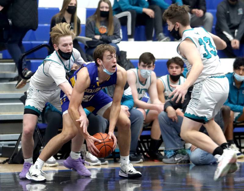 Woodstock North’s Rex White pressures Wheaton North’s Robbie Bonga during MLK Tournament action at Burlington Central High School Saturday morning.
