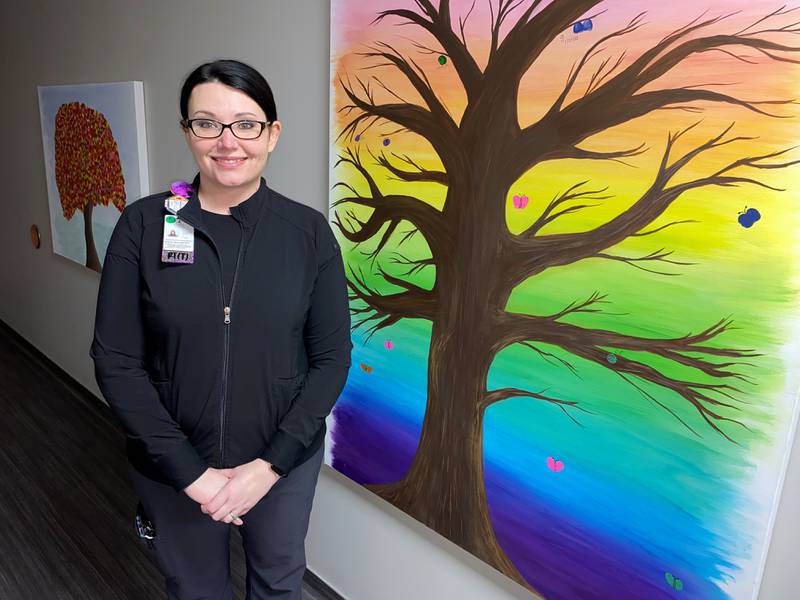 Sherah Stice, Morris radiation therapist at the Radiation Treatment Center of Morris Hospital, is also the artist for the center's Tree of Hope. The painting hangs in a hallway that leads patients to the radiation treatment room. Patients may add their thumbprint to the tree when they finish their last treatment.