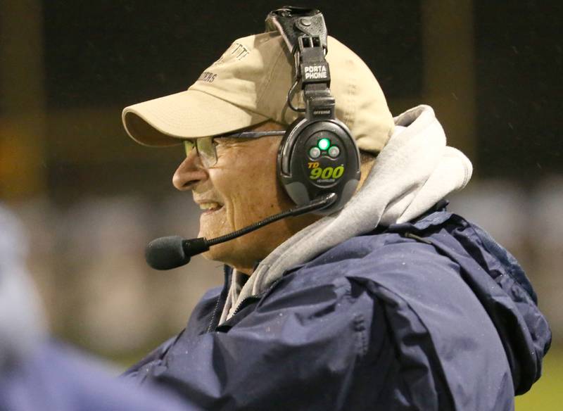 Marquette head football coach Tom Jobst smiles while coaching his team against St. Bede on Friday, Oct. 13, 2023 at Gould Stadium.