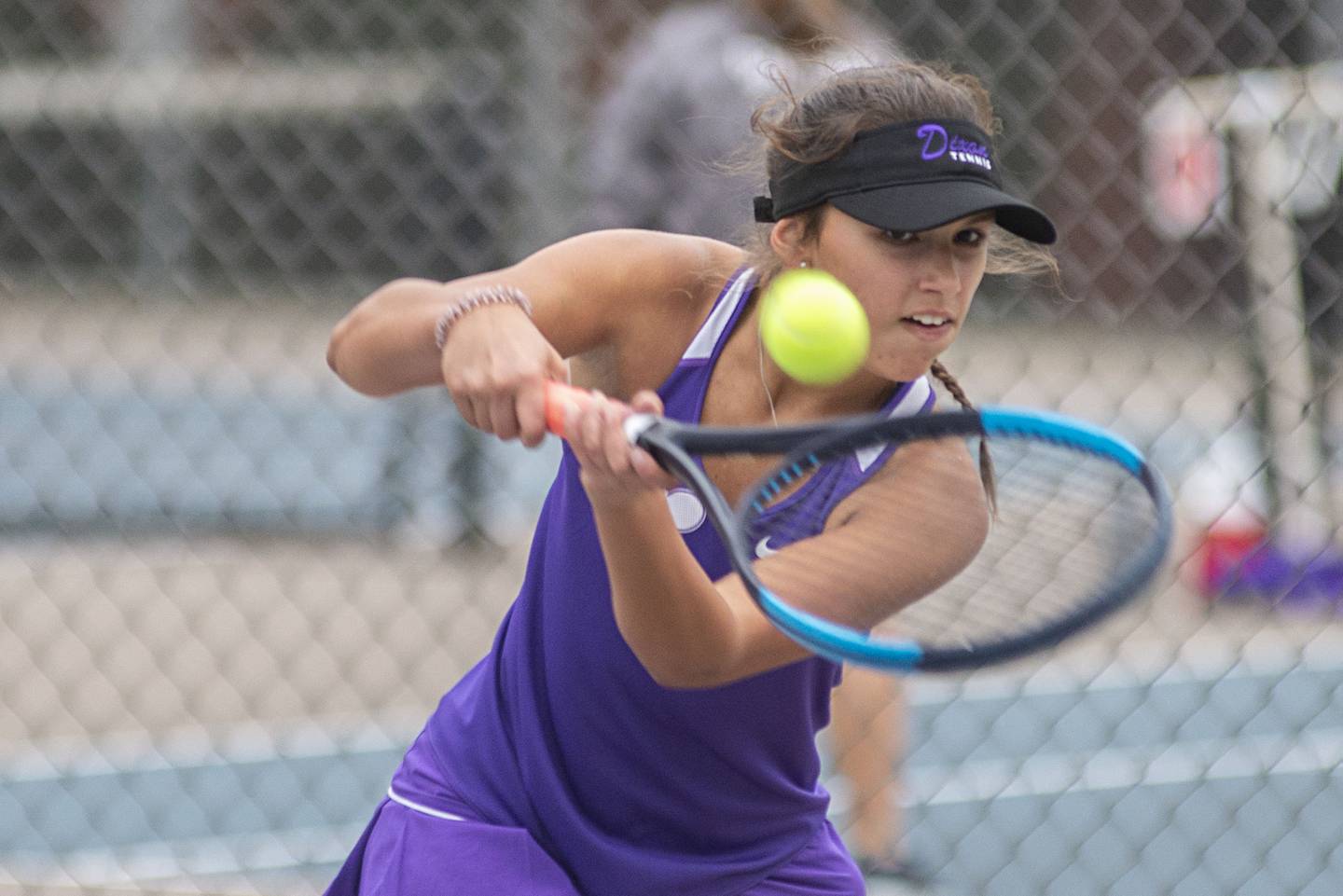 Dixon’s Addison Arjes returns a shot while playing against Newman’s Emma Oswalt Thursday, Oct. 6, 2022.