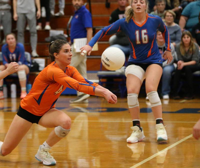 Genoa-Kingston's libero Hannah Langton (4) saves the ball as teammate Alayna Pierce (16) looks for the spike against Quincy Notre Dame in the Class 2A Supersectional volleyball game on Friday, Nov. 4, 2022 at Princeton High School.