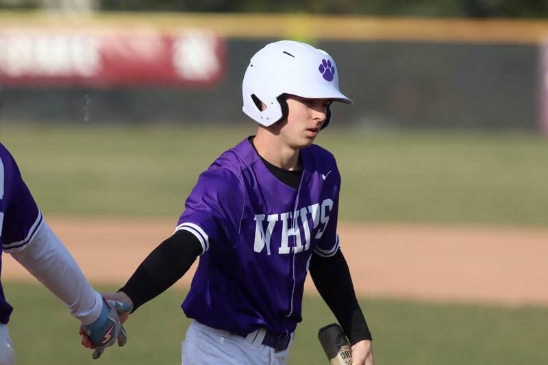 Hampshire’s Nicholas Lueders is greeted after scoring  in varsity baseball on Wednesday, April 16, 2025, at Prairie Ridge High School in Crystal Lake.