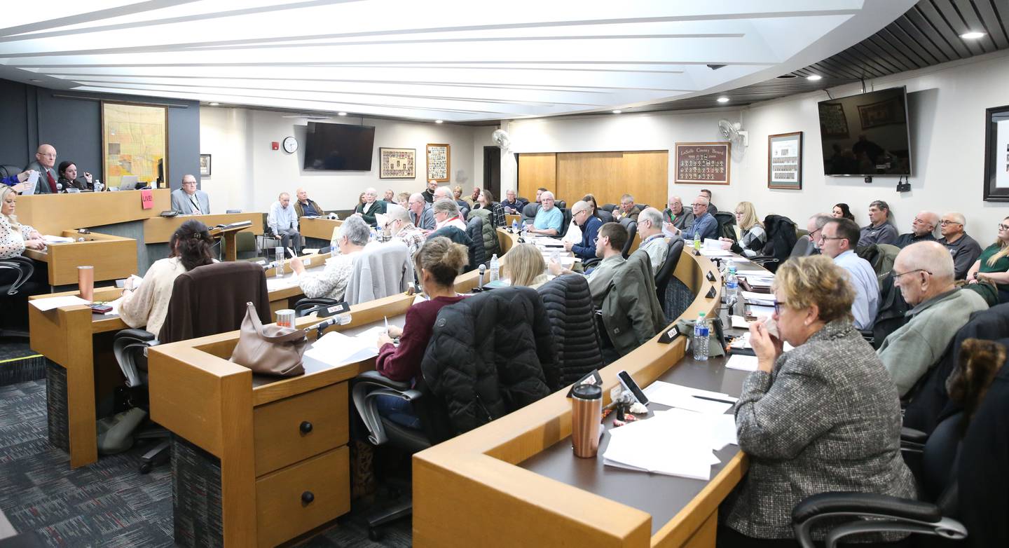 Members of the La Salle County Board vote on a resolution of a new coroner office on a property located at 520 W. Walnut St. in Oglesby on Monday, March 13, 2023 at the La Salle County Government Complex in Ottawa.