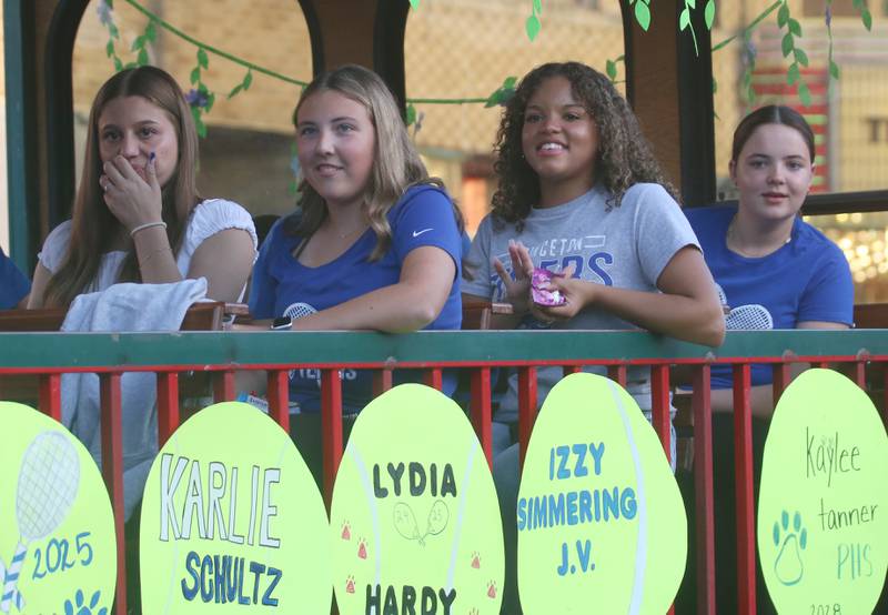 Princeton High School girls tennis players ride during the Homecoming parade on Thursday, Oct. 3, 2024 downtown Princeton.