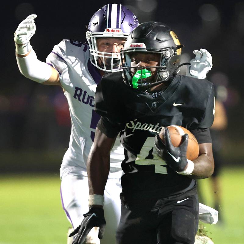 Sycamore's Tyler Curtis just beats Rochelle's Elijah Harley to the end zone for a touchdown during their game Friday, Sept. 22, 2023, at Sycamore High School.