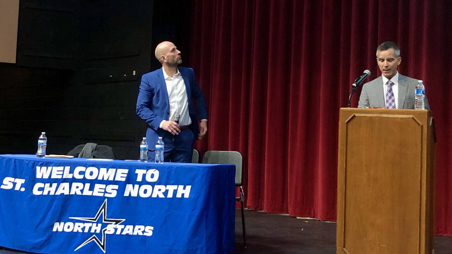 Superintendent Paul Gordon (left) and Robert Schwarz (right) on stage at the St. Charles North High School auditorium during the information session on School District 303 enrollment zone boundary changes on Nov. 28, 2023.