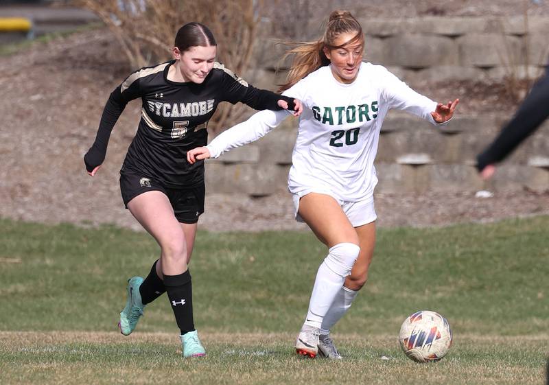 Sycamore's Grace Amptmann and Crystal Lake South's Gracey LePage chase down the ball during their game Thursday, March 21, 2024, at Sycamore High School.