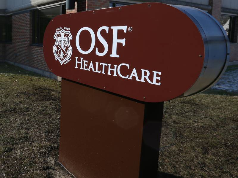 A new OSF Healthcare sign is erected near the Building B entrance at 920 West Street at the former IVCH and St. Margaret's Hospital on Tuesday, Feb. 20, 2024 in in Peru